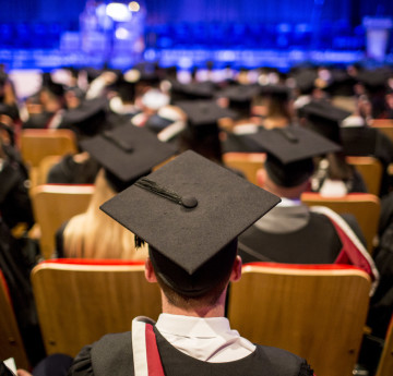 Graduates in a graduation ceremony. 