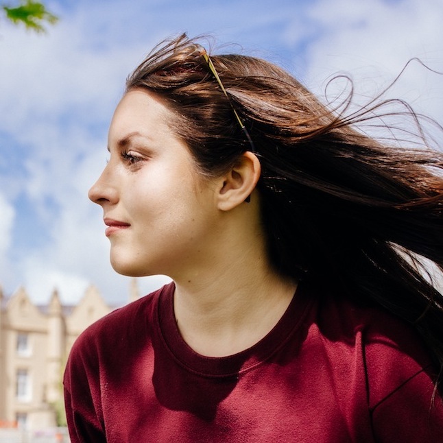 Student sitting outside the Abbey