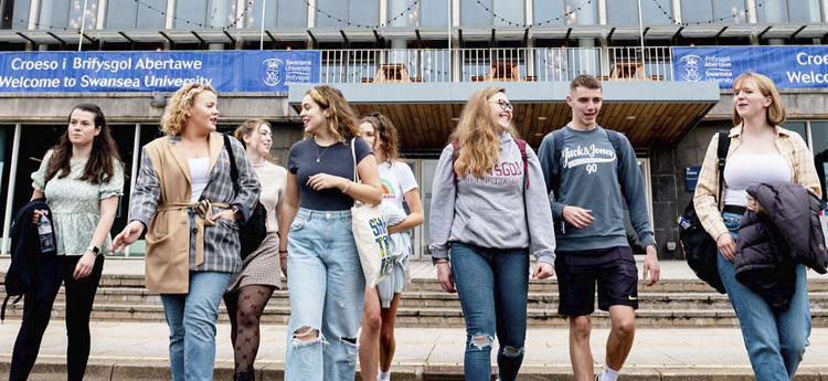 Welsh-medium students outside Fulton House on Singleton Campus