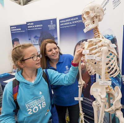 Student with a skeleton at the GwyddonLe