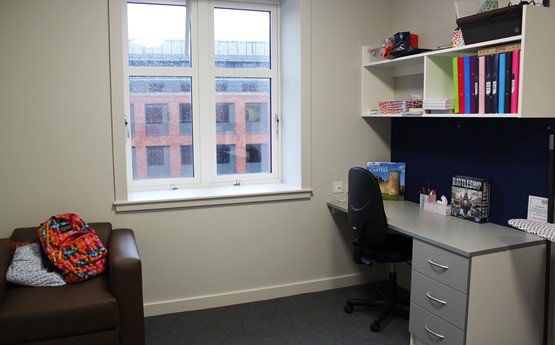 A desk, chair and window