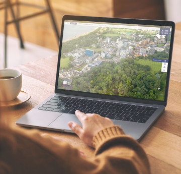 A laptop showing a Swansea virtual tour