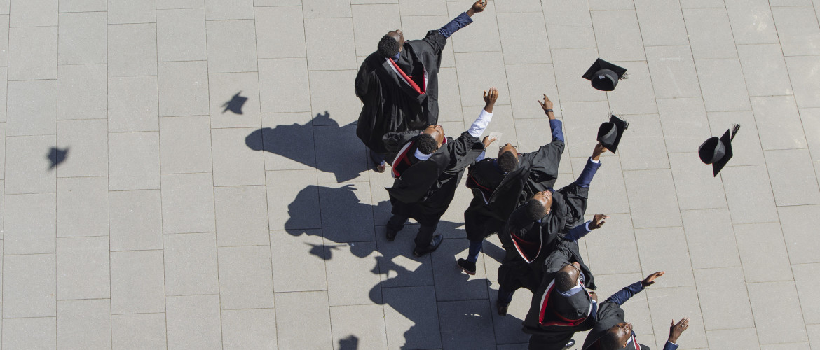 Graduates throwing their hats in the air