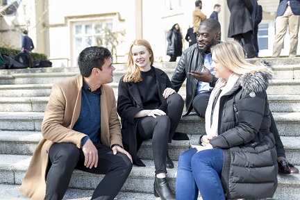 Students sitting on steps.