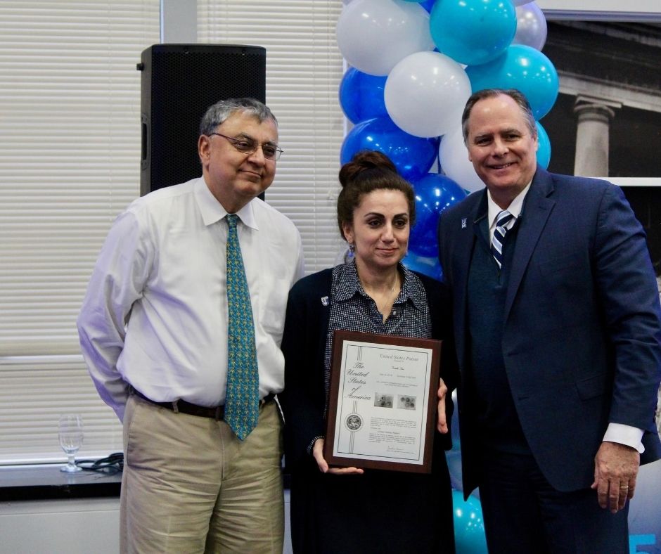 Firouzeh being presented with an award.