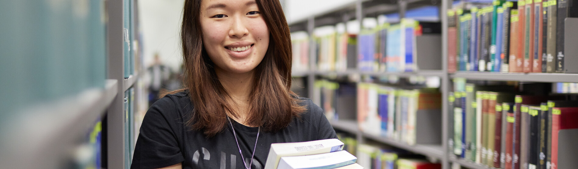 woman in library with books