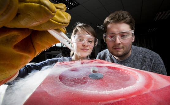 two students doing an experiment 