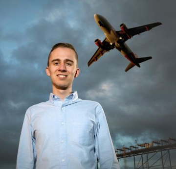 boy with a plane flying overhead