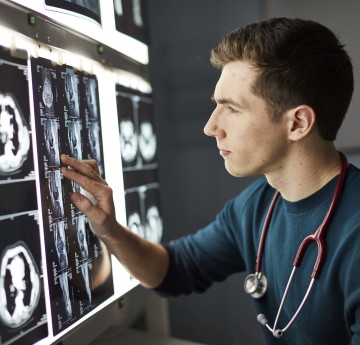 Man looking at x-ray