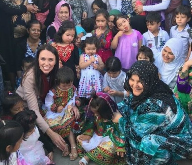 Jacinda Ardern with refugees at project Refugee Centre. 