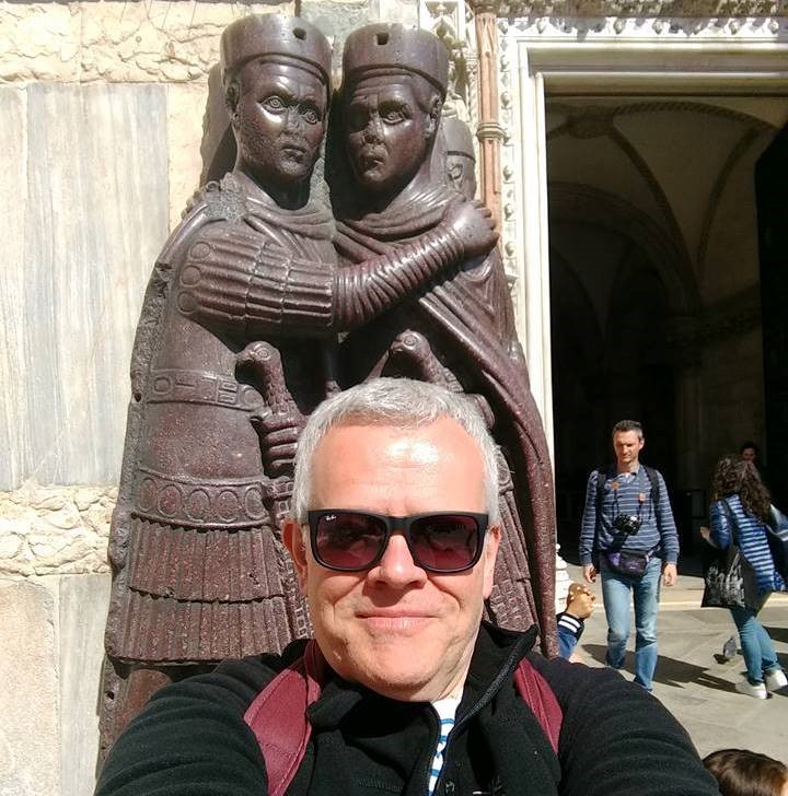 Nigel Pollard in front of a monument 