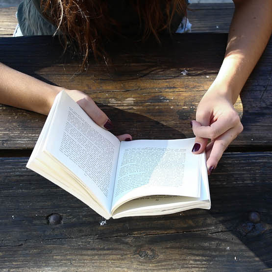 Image of the person reading a book