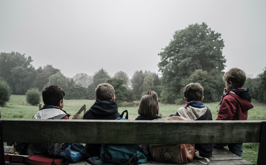 image of children on the bench