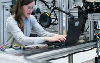 Student working on a laptop in a lab