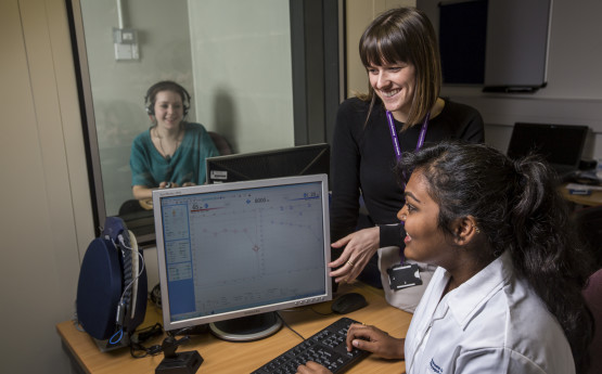 Students and tutor in an audiology lab