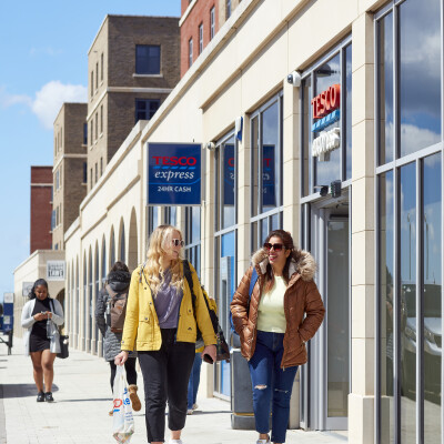 students walking outside tesco on campus