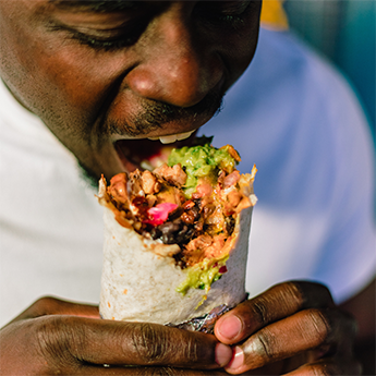 Person eating a burrito