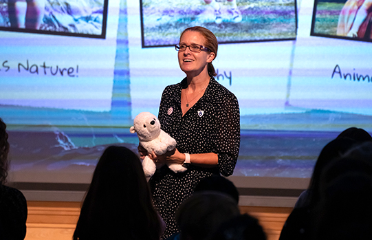 Hannah Gold onstage with cuddly Polar Bear toy