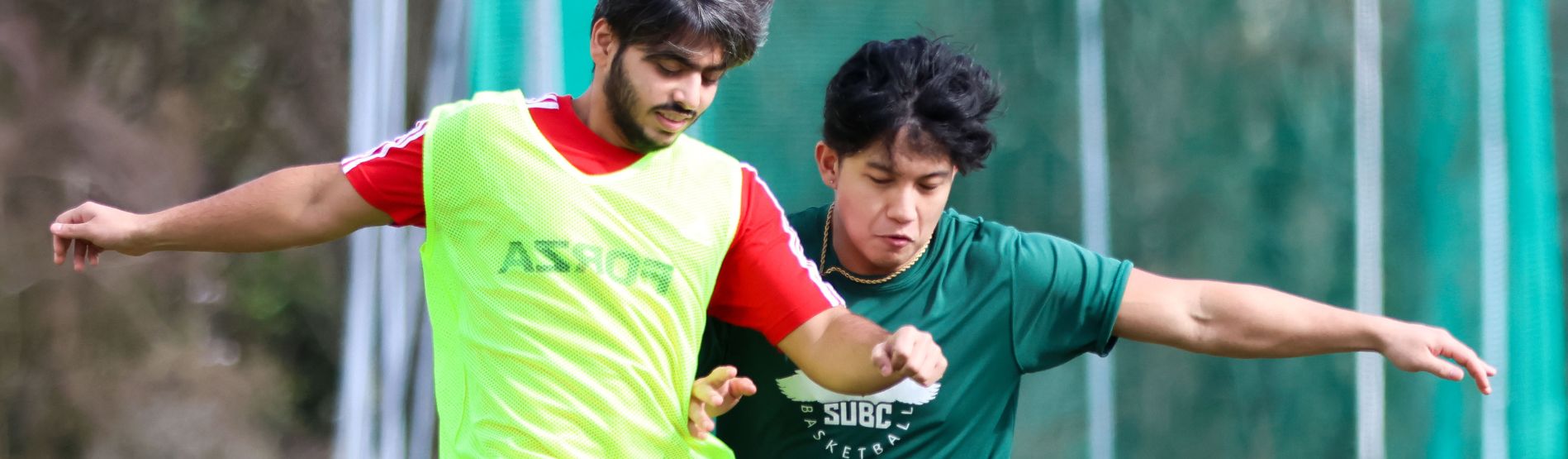 Two students running outside 