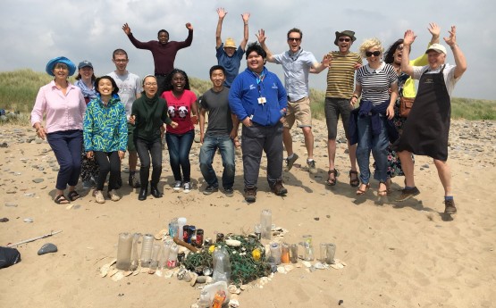 Students taking part in a beach clean.