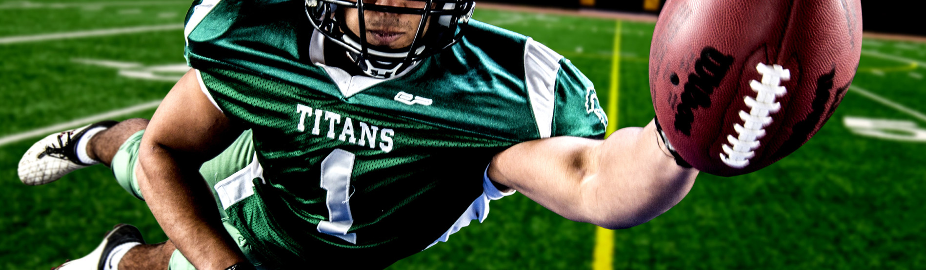 American football player diving for a touchdown