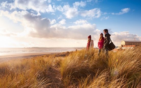 students walking on a beach