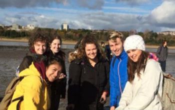 Students standing on a saltmarsh