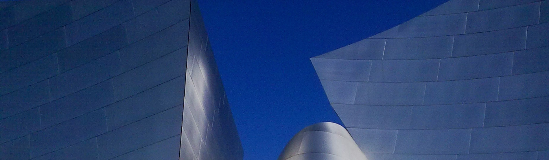 Abstract buildings against dark blue sky