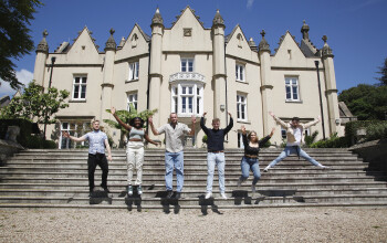 students in front of the abbey building