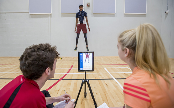 Student jumping for experiment