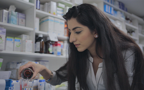 Student Pouring a Medicine