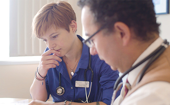 Student and Lecturer reviewing notes 