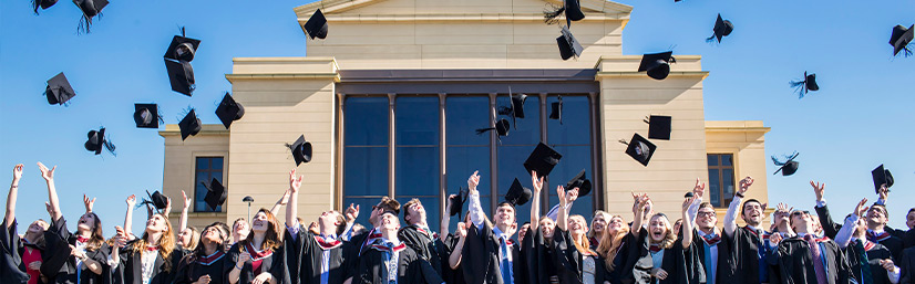 Students throwing hats