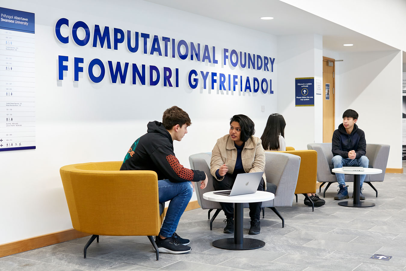 Students sat outside lecture rooms in the Foundry