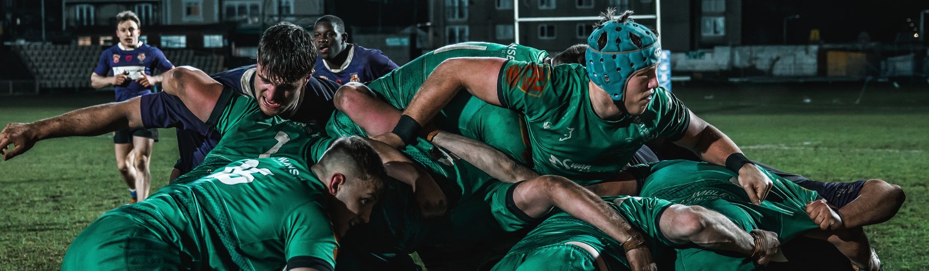 Swansea University female student rugby player running clear with the ball at the Principality Stadium. 