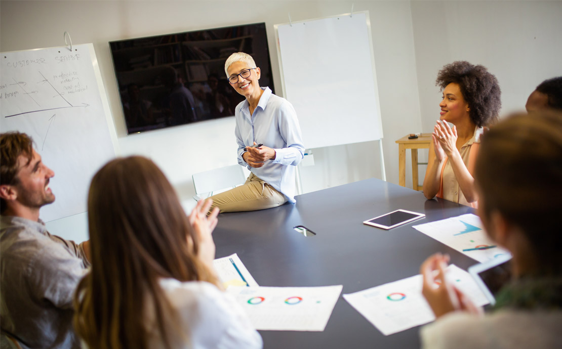 A group of people in a meeting