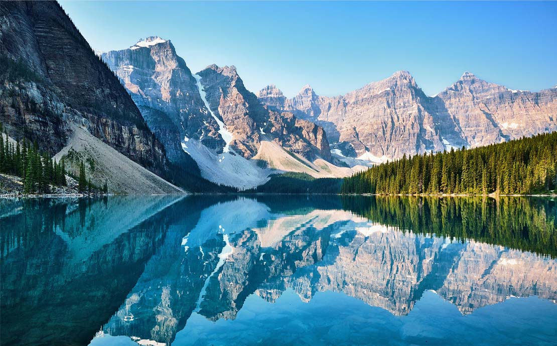 Snow topped mountains and a lake in Canada