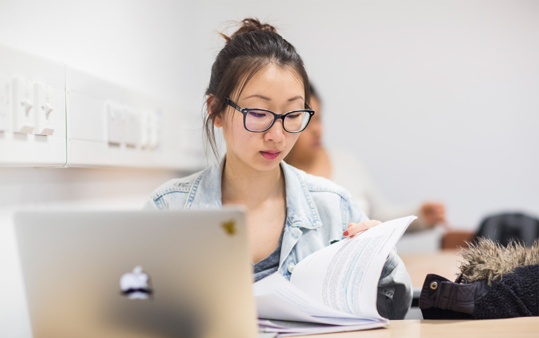 A student working on a laptop