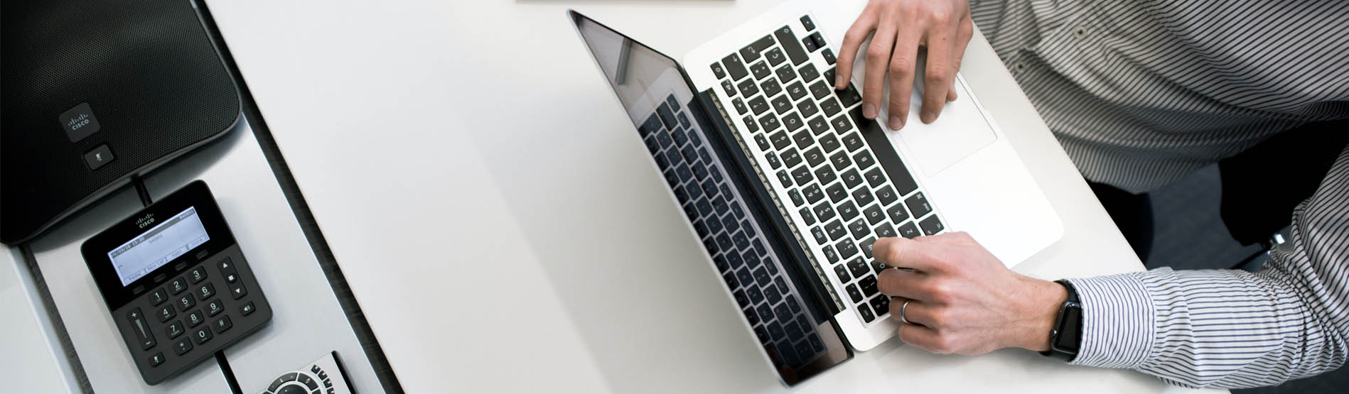 A person typing on a laptop