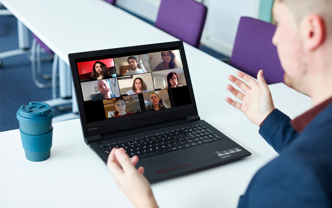 A group of people in a meeting