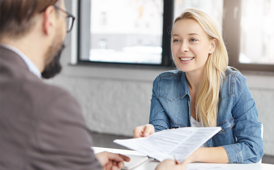 A professional man and woman having a meeting