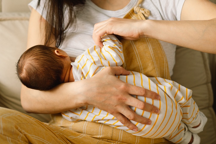 Woman breastfeeding baby