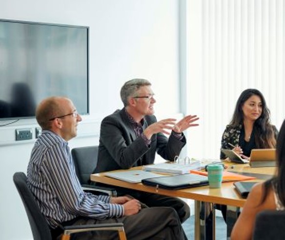 Man presenting in boardroom