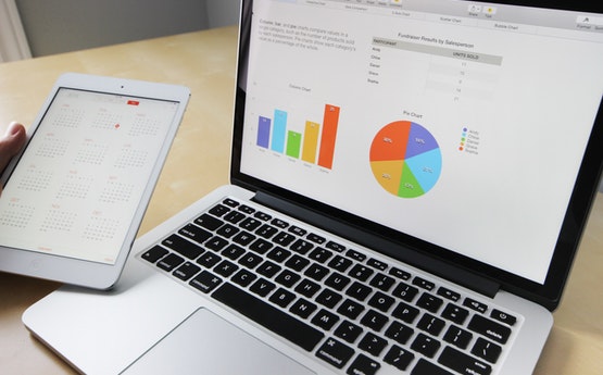 Laptop screen with graphs