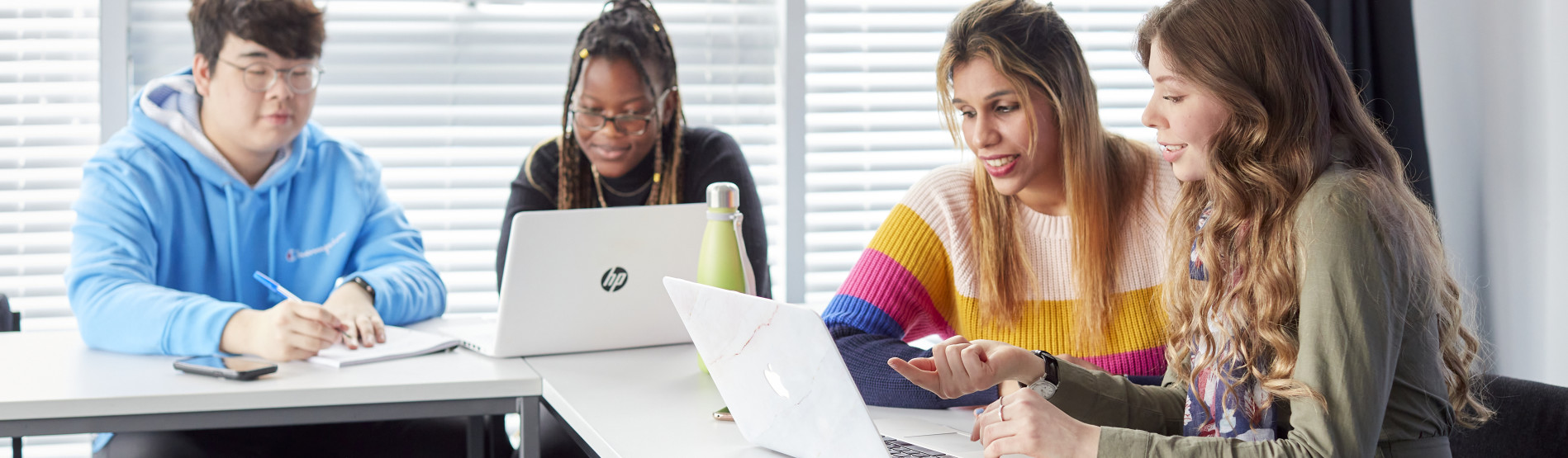 STUDENTS ON THEIR COMPUTER