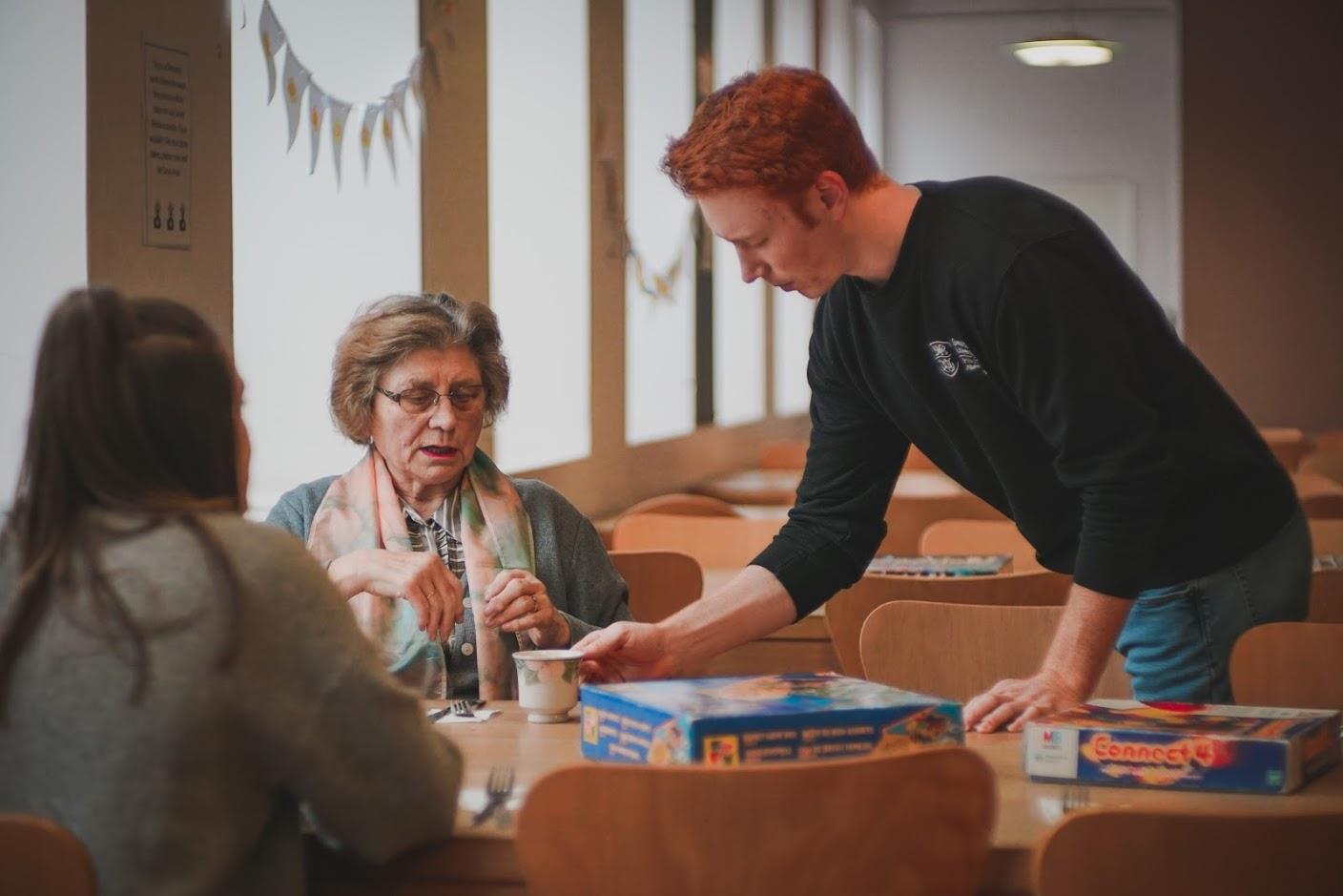 Volunteers serving meals at a community meal