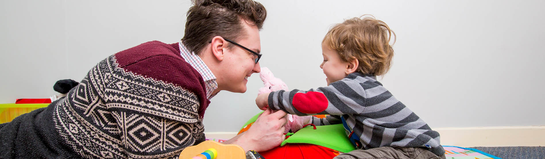 adult and child playing