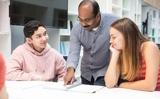 lecturer helping students