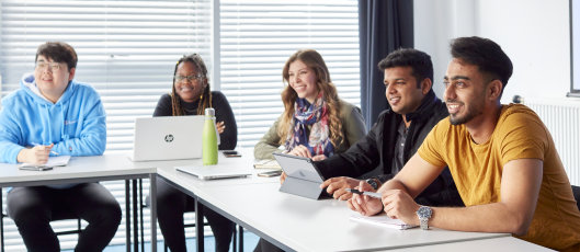 Students in a study group working together