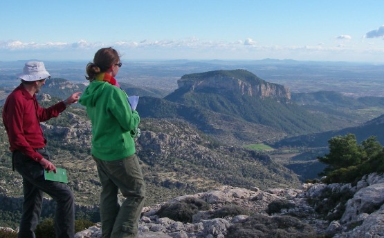 Student and Lecturer looking over Majorca coastline 